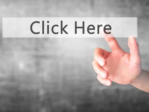 Click Here - Hand pressing a button on blurred background concept on visual s Stock Photos