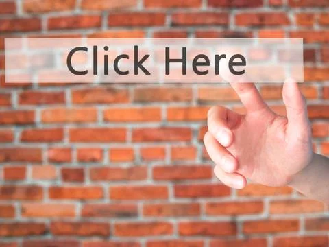 Click Here - Hand pressing a button on blurred background concept on visual s Stock Photos