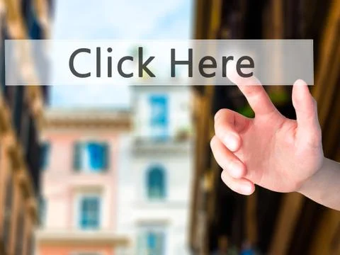 Click Here - Hand pressing a button on blurred background concept on visual s Stock Photos