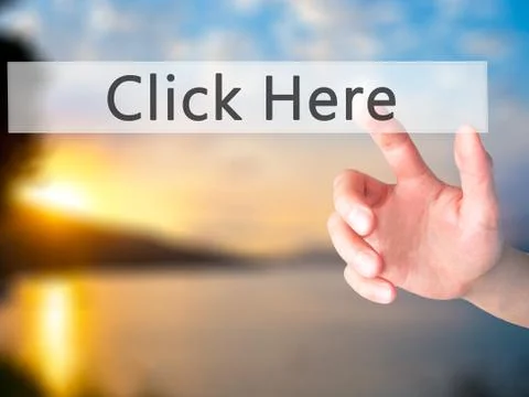 Click Here - Hand pressing a button on blurred background concept on visual s Stock Photos