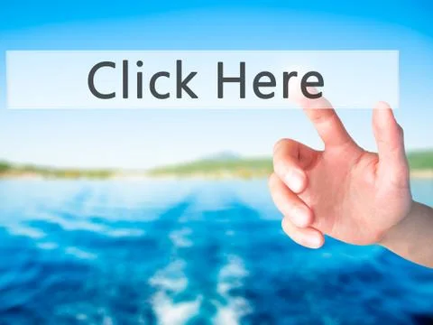 Click Here - Hand pressing a button on blurred background concept on visual s Stock Photos