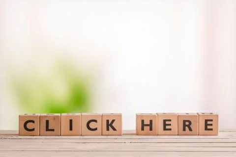 Click here message on a table Foto stock