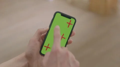 Click on the phone screen (the screen is green) Stock Footage 240739758