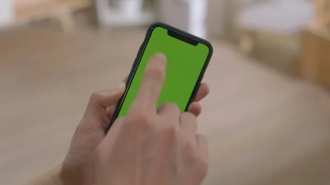 Click on the phone screen (the screen is green) Stock Footage 240739894
