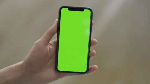 Click on the phone screen (the screen is green) Stock Footage 240740071