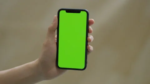 Click on the phone screen (the screen is green) Stock Footage 240740335