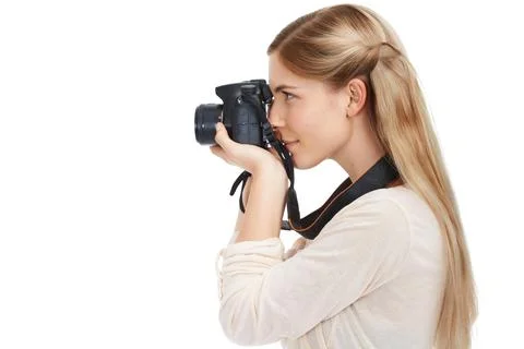 Click. Studio shot of a beautiful young woman taking pictures with her camera Stock Photos