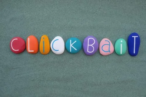 Clickbait word composed with multicolored stone letters Stock Photos