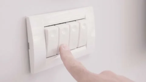 Clicking and turning off a light switch in room or office - close up shot Stock Footage 135252256