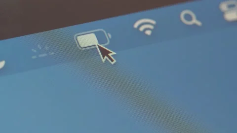 Clicking on the Battery Icon of a Laptop Computer to Check Settings Stock Footage 148239855