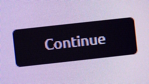 Clicking the button Continue on computer screen Stock Footage 129601186