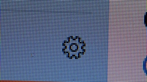 Clicking the configuration gear button in a computer screen Stock Footage 118859266