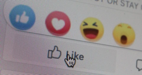 Clicking on facebook heart, like Stock Footage 127795592