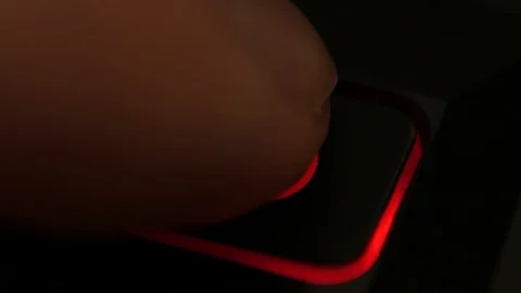 Clicking finger pressing  power button on computer keyboard, turning on computer Stock Footage 122592467