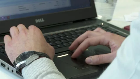 Clicking mouse and typing close up white and black keyboards Stock Footage 250875357