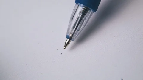 Clicking pen above white empty paper extreme close view Video stock 120469885