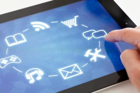 Clicking on a tablet with touchscreen interface Stock Photos