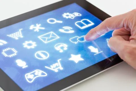 Clicking on a tablet with touchscreen interface Stock Photos