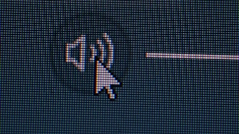 Clicking the volume mute icon in a computer screen monitor Stock Footage 118859422