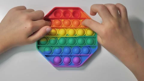 Clicks on the toy Pop It Fidget. side view, top view Video stock 156469464