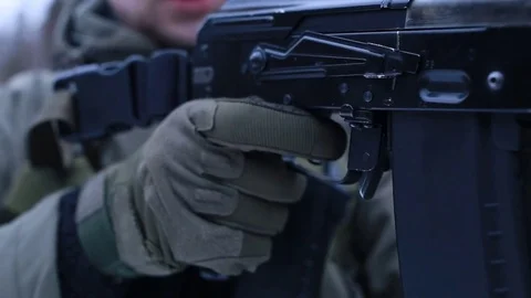 Clicks the trigger of a weapon AK Stock Footage 83176068