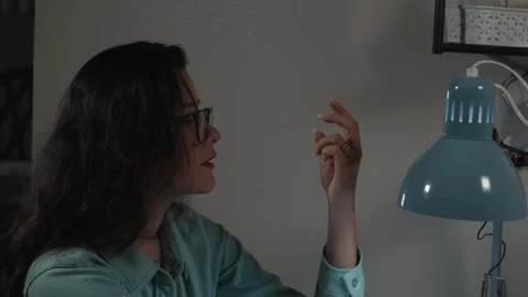 Client admires shape of artificial nails before final polish Stock Footage 327216969