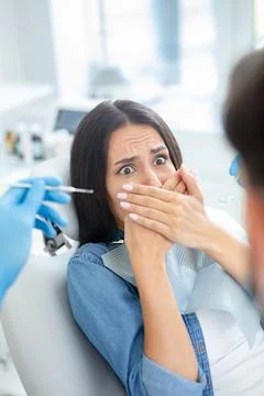 Client is afraid of dentist in dental office Stock Photos