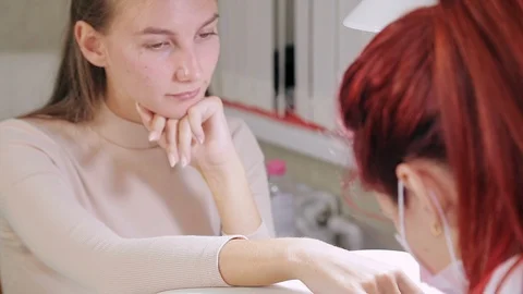 A client of a beauty salon during the procedure for preparing nails for gel Stock Footage 121005647