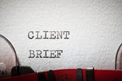 Client brief text written with a typewriter. Stock Photos