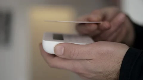 Client buying with Pos payment in shop or supermarket. Closeup of hand Stock Footage 148753330