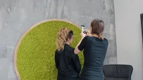 Client capturing her new hairstyle with smartphone in salon mirror 動画素材 273224516