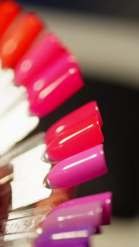 The client chooses the color of the nails on the samples. Stock Footage 313532990