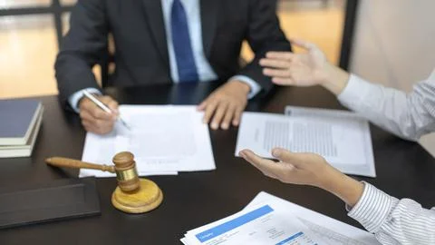 Client describes the money fraud problem and discusses the solution with a la Stock Photos