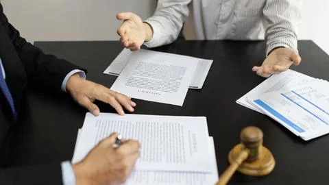 Client describes the money fraud problem and discusses the solution with a la Stock Photos