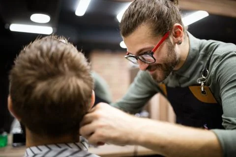 Client during beard and moustache grooming in barber shop Stock Photos