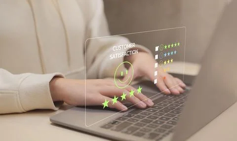Client give five star rating to service experience on computer app. Stock Photos