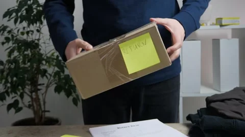 The client hands over a box with the goods marked "return" Video stock 311966753