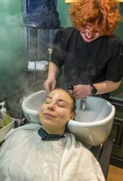 The client is having his head washed in a beauty salon Foto stock