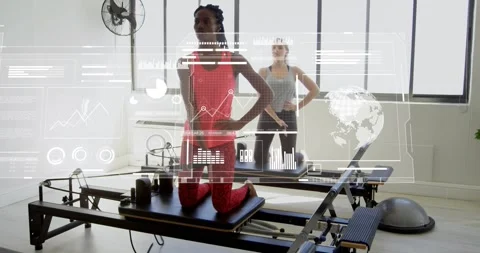 Client mounting Pilates reformer gripping handles, pulling and improving posture Stock Footage 317842056