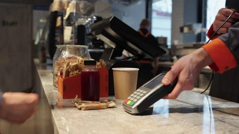 Client pay with credit card on pos terminal at cafe counter Spbi. Wireless Stock Footage 153827255