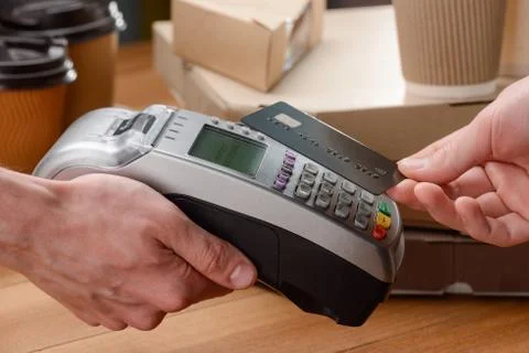 Client paying for his purchase Stock Photos