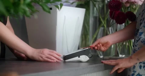 Client pays by card in the flower store Stock Footage 279501135