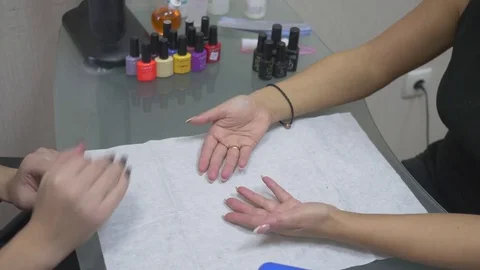 The client puts his hands on his hands in the nail salon Stock Footage 71176113