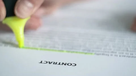 The client reads the paper document "Contract". Stock Footage 157271050