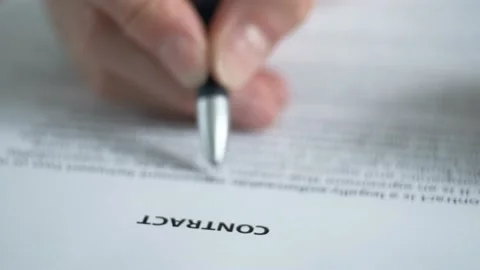 The client reads the paper document "Contract". Stock Footage 157867236