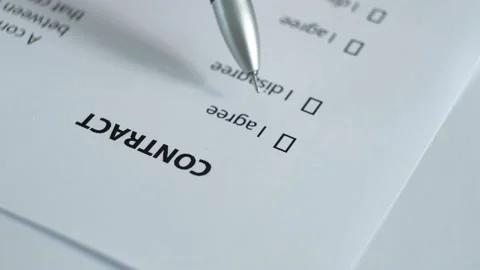 The client reads the paper document "Contract". Stock Footage 158679992