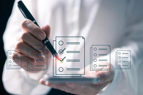 Client reviewed document, using checklist to mark each checkbox, ensuring i.. Stock Photos