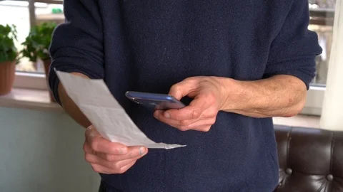 The client scans the QR code from the check using the app on your smartphone Stock Footage 124720683