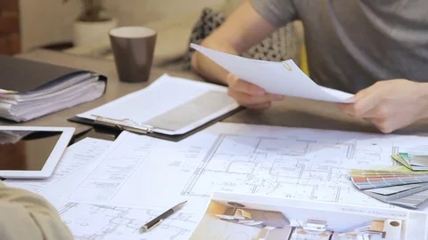 The client signs the contract and sends the copy to the designer. Stock Footage 77552968