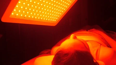 Client sitting under infrared to the left Stock Footage 107758670